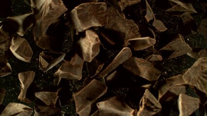 Poster - Super slow motion of rotating group of raw chocolate pieces. Super fast camera motion. Filmed on high speed cinema camera, 1000fps, placed on high speed cine bot.