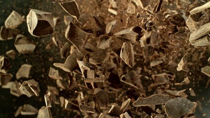 Poster - Super slow motion of rotating group of raw chocolate pieces. Super fast camera motion. Filmed on high speed cinema camera, 1000fps, placed on high speed cine bot. Speed ramp effect.