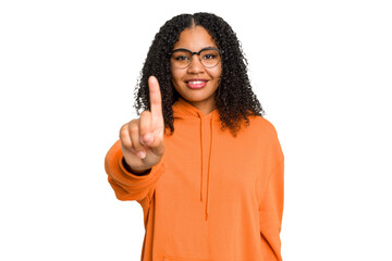 Young african american woman with curly hair cut out isolated showing number one with finger.