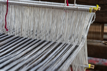 Wall Mural - Old hand-weaving vintage wooden loom being used to make fabric