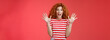 Extremely wonderful news she excited. Thrilled emotive gorgeous redhead woman scream amazed awesome surprise raise hands waving impressed open mouth stare charmed fascinated red background