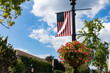 Hanging Flowers and an American Flag along Greenwich Avenue in Downtown Greenwich Connecticut during the Summer