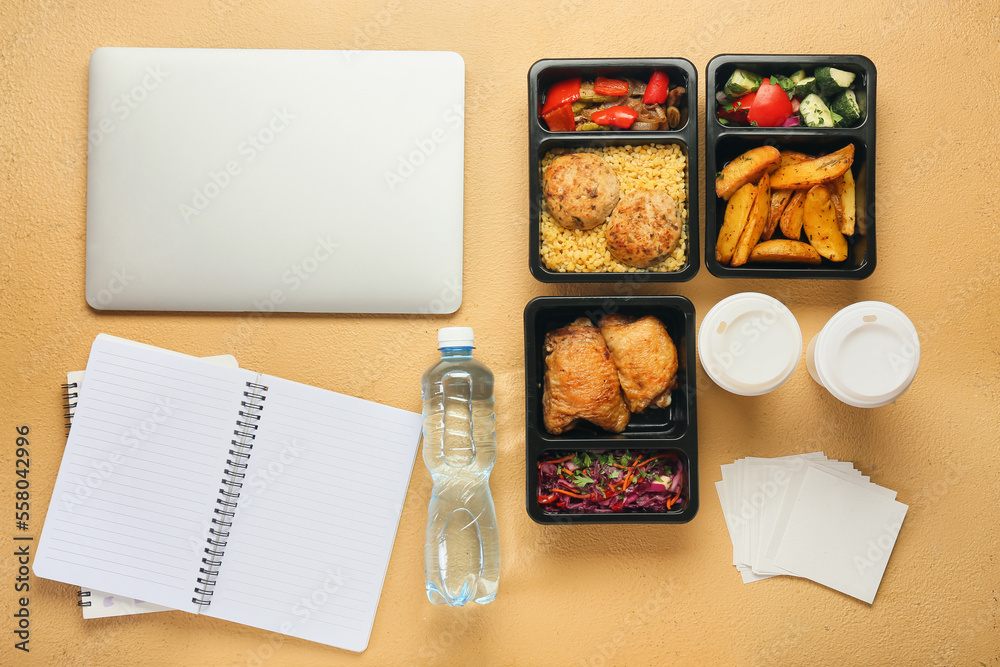 Composition with laptop, food in containers and notebooks on color background