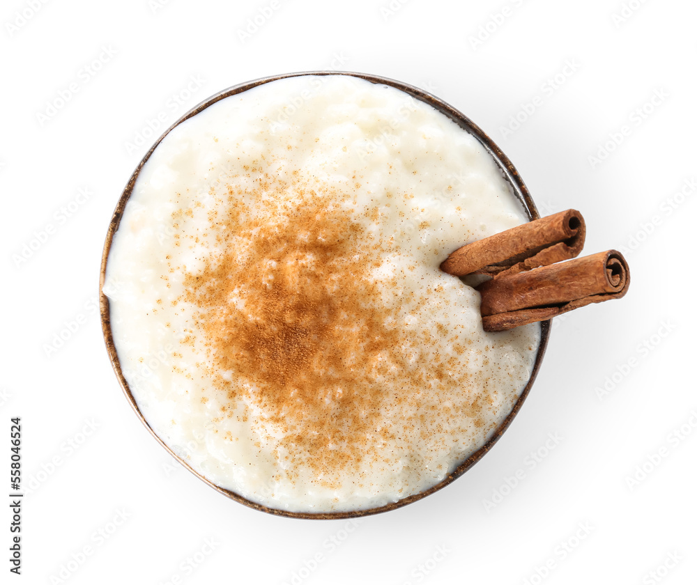 Bowl with delicious rice pudding and cinnamon on white background