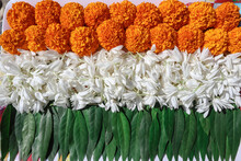Indian Tricolor Theme Of Indian National Flag Made Of Orange Marigold Flowers, White Jasmine Flowers And Green Fresh Leaves.