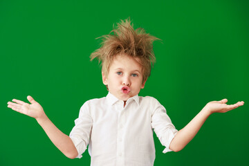 Poster - Surprised child against green chalkboard in class