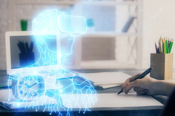 Poster - AR hologram over woman's hands taking notes background. Concept of augmented reality. Multi exposure