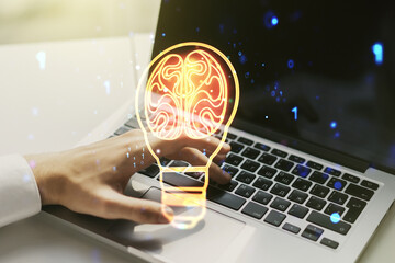 Poster - Creative light bulb with human brain hologram and with hands typing on computer keyboard on background, artificial Intelligence and neural networks concept. Multiexposure