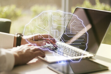 Poster - Double exposure of creative artificial Intelligence symbol with hands typing on laptop on background. Neural networks and machine learning concept