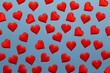 Red hearts on a bright blue background. Inspired by love and passion. Blue background with red hearts for Valentine's day.