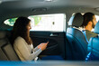 © AntonioDiaz - Beautiful woman on a rideshare service car