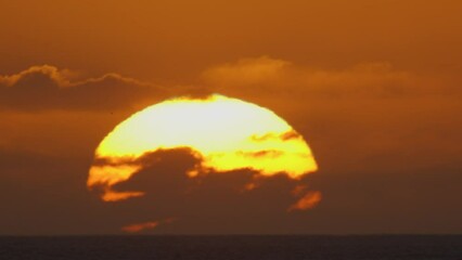 Wall Mural - beautiful evening sunset with big sun on atlantic ocean. beautiful screensaver for any of your proje