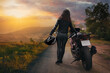 slender sexy girl posing with a motorcycle
