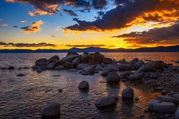 Wall Mural - Sunset above rocky beach of Lake Tahoe in California