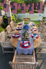 Wall Mural - Festive Fourth of July party table set under garden pergola