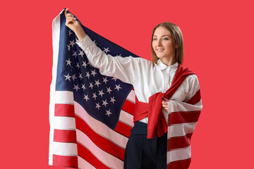 Wall Mural - Beautiful woman with USA flag on red background