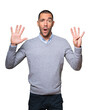 © agongallud - Happy young man doing a number nine gesture with his hands