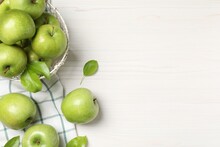 Fresh Ripe Green Apples With Leaves On White Wooden Table, Flat Lay. Space For Text