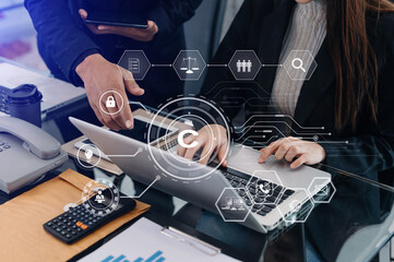 Wall Mural - Copyright or patent concept, Business team analyzing data and using smart phone and tablet with virtual screen copyright icon trademark license, Creation ownership against piracy.