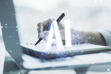 Poster - Creative artificial Intelligence symbol concept with hand writing in notebook on background with laptop. Multiexposure