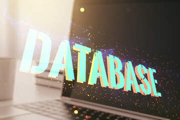 Poster - Double exposure of Database word sign on laptop background, global research and analytics concept