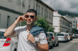 © tetxu - casual man with sunglasses on the street