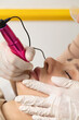 © Виктория Попова - The client during the procedure of permanent lip makeup. Permanent tattoo artist works with clients