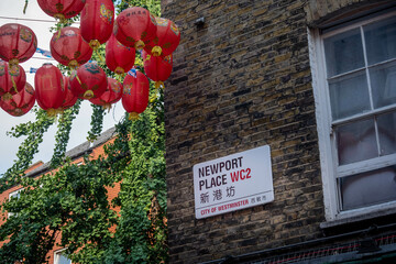 Poster - London-  Newport Place street sign in London's China Town area of Soho in the west end.