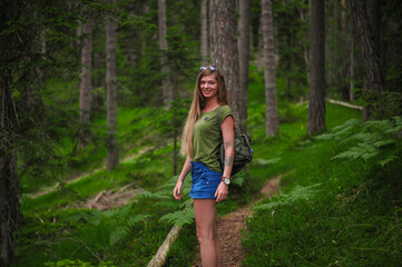 charming cute smiling girls with an open, honest faces against a forest in a soft light