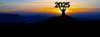 Happy new Year - Landscape background banner panorama 2025 - Breathtaking view with black silhouette of mountains and man holding year, in the morning during the sunrise