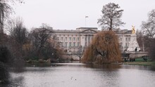 4K Video With Buckingham Palace Landmark Building During A Cloudy Day, View From St James Park. Travel To London.