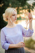 © prokop.photo - Blonde girl on a summer day on the shore near the river in nature in a dress