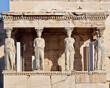 Caryatids, women figures statues at Erechtheion ancient Greek temple, on Acropolis hill. A cultural travel in Athens, Greece.