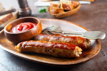 Wall Mural - Sausages fried with spices and herbs, Selective focus