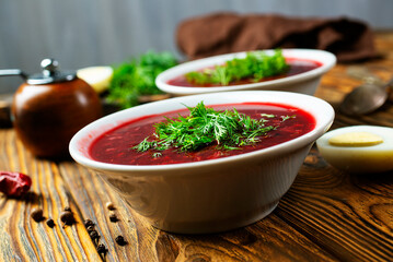 Canvas Print - Traditional Ukrainian Russian borscht . Bowl of red beet root soup borsch with white cream . Beet Root delicious soup . Traditional Ukrainian food cuisine