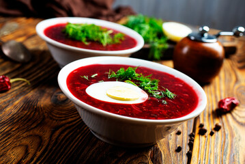 Canvas Print - Traditional Ukrainian Russian borscht . Bowl of red beet root soup borsch with white cream . Beet Root delicious soup . Traditional Ukrainian food cuisine