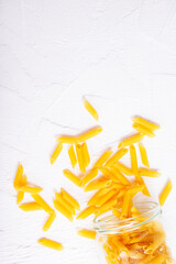 Poster - Raw dry Italian pasta in glass bank