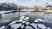 Ice Floes On A River Through The City
