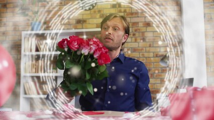 Poster - Animation of light spots and circles over caucasian man holding roses