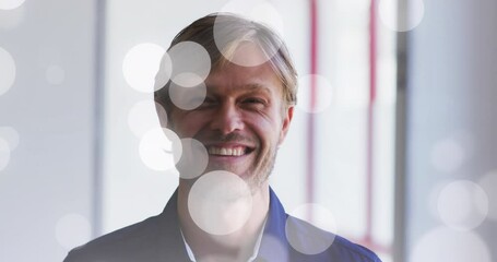Poster - Animation of light spots over caucasian man smilig