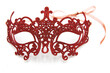 Shiny red masquerade mask isolated on white background.	