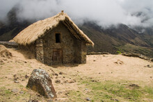 A Larger Thatch Roof Stone Structure In The Traditional Village Of The Q'eros High In The Peruvian Andes.