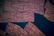 Aerial View Of Logs In A River.