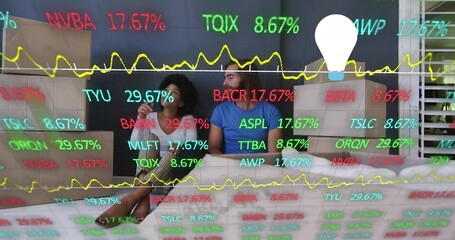 Aufkleber - Animation of financial data processing with light bulb icon over diverse couple moving house