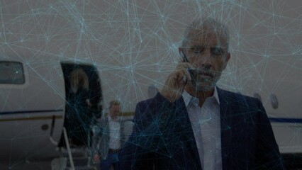 Poster - Animation of network of connections over caucasian businessman using smartphone