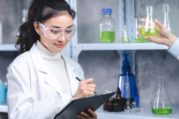 Wall Mural - Scientist wearing glasses and gloves checking hemp plants in a marijuana farm, Marijuana research for CBD oil, alternative herbal medicine concept, pharmaceutical industry laboratory for business