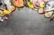 Leinwandbild Motiv Flat lay composition with fresh raw dorado fish and different seafood on grey table. Space for text
