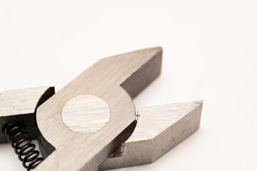 Close up pliers in white background. Selective focus.