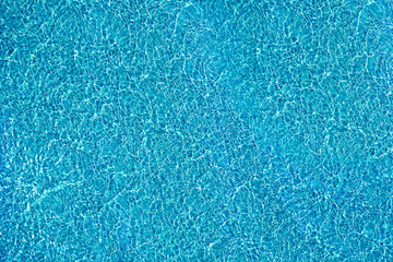 Wall Mural - Blue water texture, on the surface of a clear blue lake.