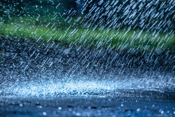 raindrops fall on the asphalt. close up deterioration of weather conditions. precipitation, cooling.